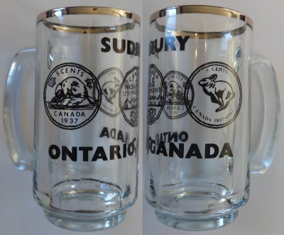 Canada 5-cent coins on glass mug